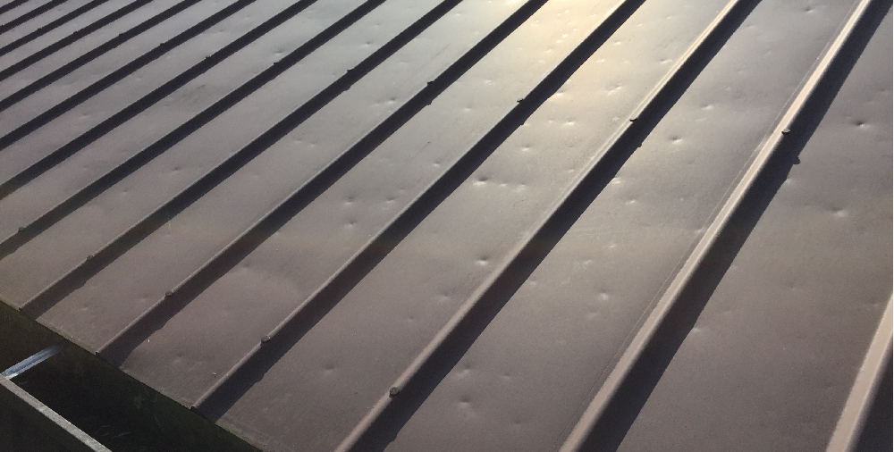 Stay Dry and Secure: The Advantages of a Flat Roof from AWS Roofing